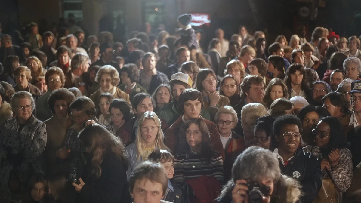 A crowd at a 1976 Carter campaign event, archival footage from Carter Country